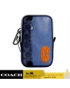 กระเป๋า COACH C3203 NORTH/SOUTH HYBRID POUCH IN COLORBLOCK SIGNATURE CANVAS (QBSDQ)